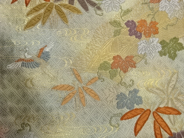  笹に蔓草・鶴・流水模様織出し袋帯